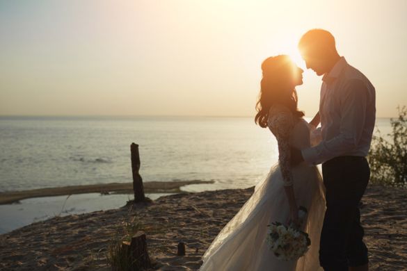newlywed couple married on the beach