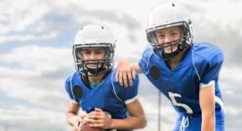 two youth football players